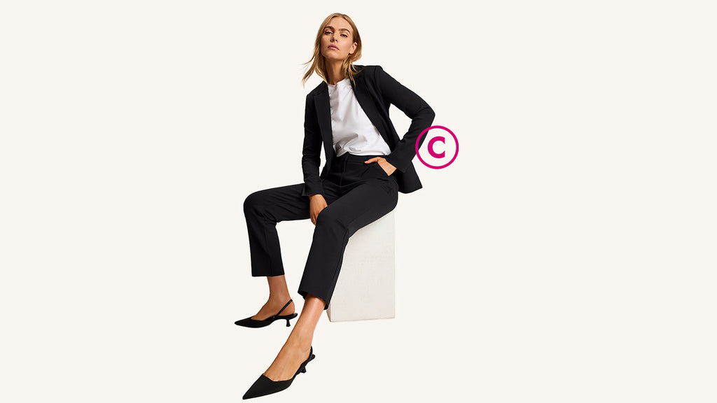Model on grey background wearing CEO set in black
